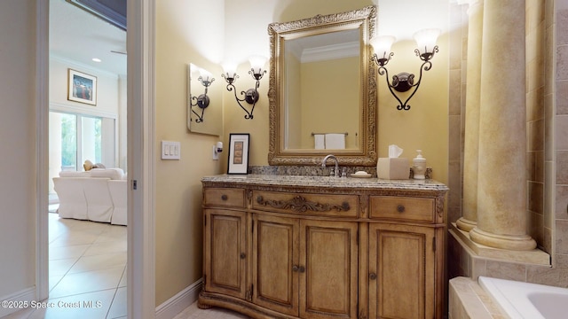 bathroom with crown molding, tile patterned floors, and vanity