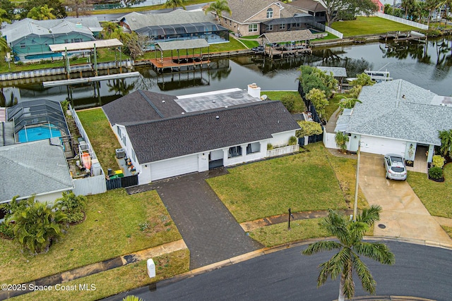 drone / aerial view with a water view