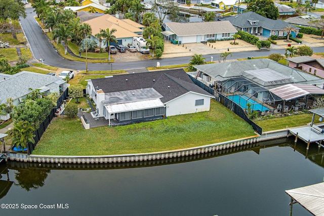 drone / aerial view with a water view