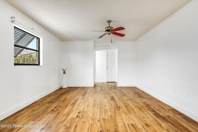 unfurnished room featuring ceiling fan, crown molding, a textured ceiling, and light hardwood / wood-style floors