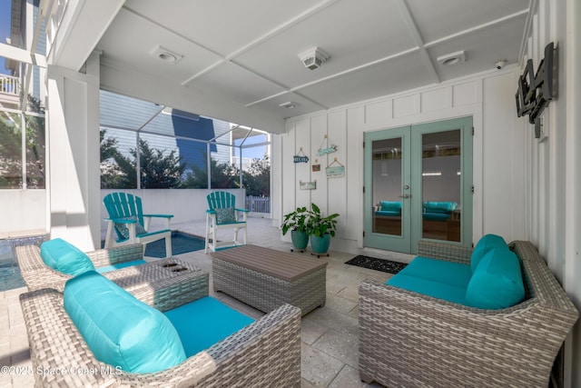 view of patio with outdoor lounge area, french doors, and glass enclosure