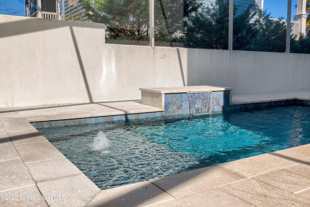 view of pool with pool water feature