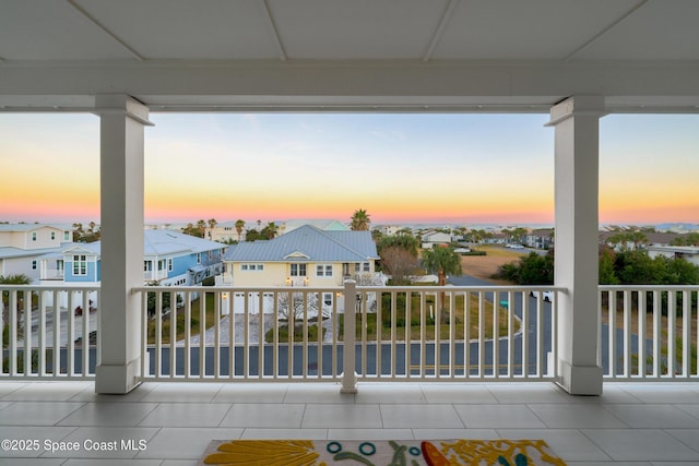 view of balcony at dusk