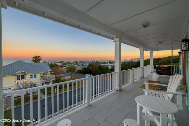 view of balcony at dusk