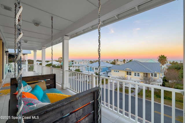 view of balcony at dusk