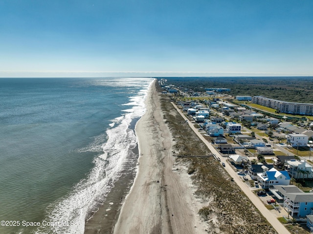 bird's eye view featuring a beach view and a water view