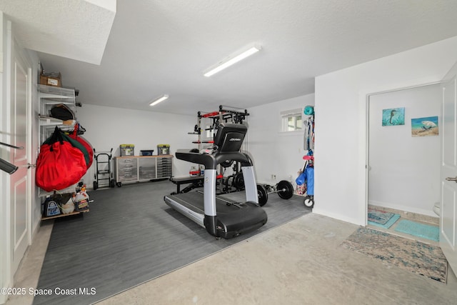 workout room with a textured ceiling