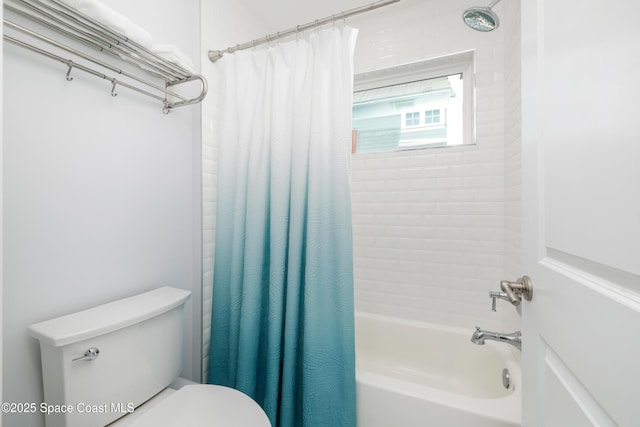 bathroom with shower / bath combo and toilet