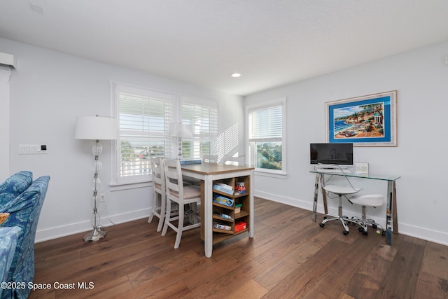 home office with dark hardwood / wood-style floors