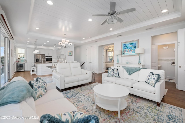 living room featuring wood ceiling, beverage cooler, a raised ceiling, and hardwood / wood-style flooring