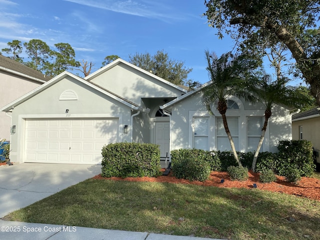 view of front of house featuring a garage and a front yard