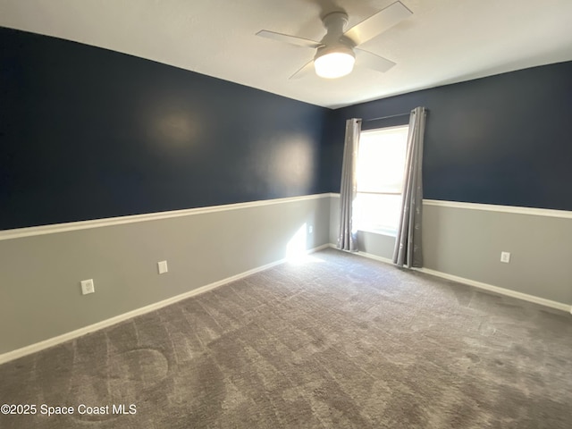 unfurnished room featuring ceiling fan and carpet floors