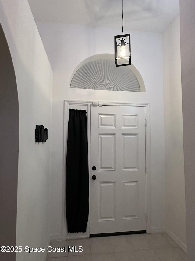 foyer entrance featuring light tile patterned floors