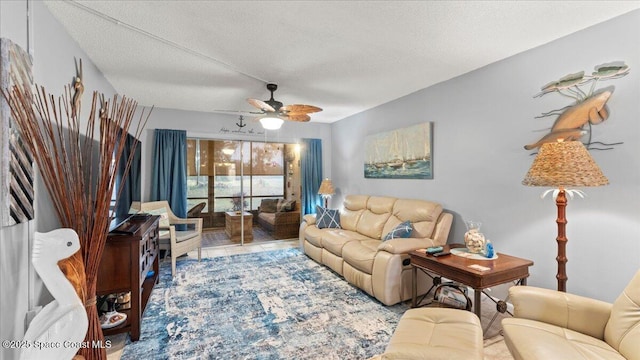 tiled living room with ceiling fan and a textured ceiling