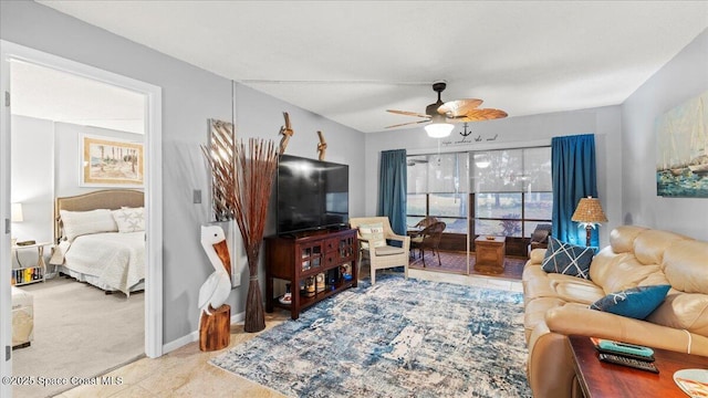 carpeted living room with ceiling fan