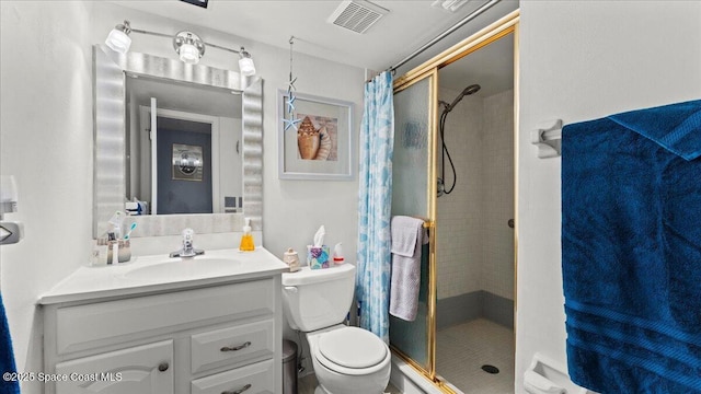 bathroom with toilet, vanity, and walk in shower