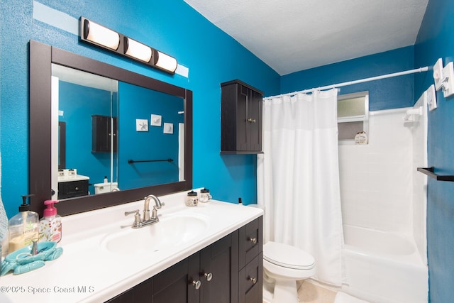 full bathroom featuring shower / bath combo with shower curtain, a textured ceiling, toilet, and vanity