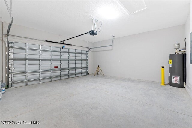 garage featuring water heater and a garage door opener