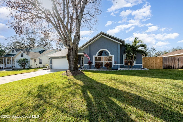 view of front of property with driveway, stucco siding, fence, an attached garage, and a front lawn