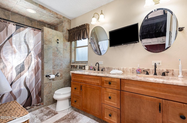 bathroom featuring tile walls, a shower with shower curtain, vanity, a textured ceiling, and toilet