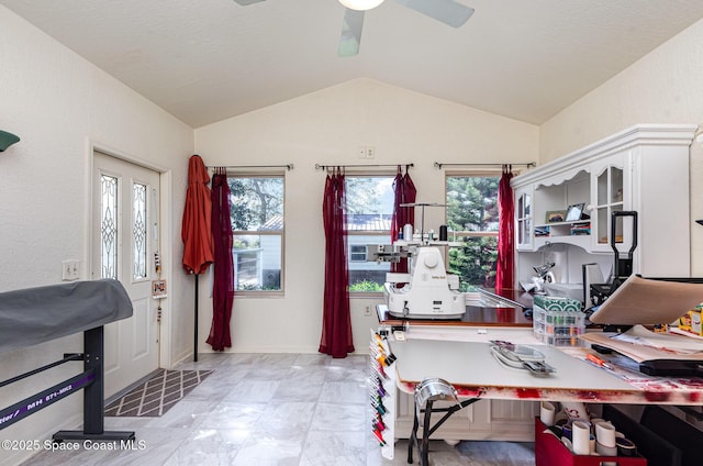 office space featuring vaulted ceiling and ceiling fan