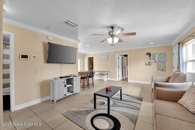 living room with crown molding, ceiling fan, a textured ceiling, and light tile patterned floors