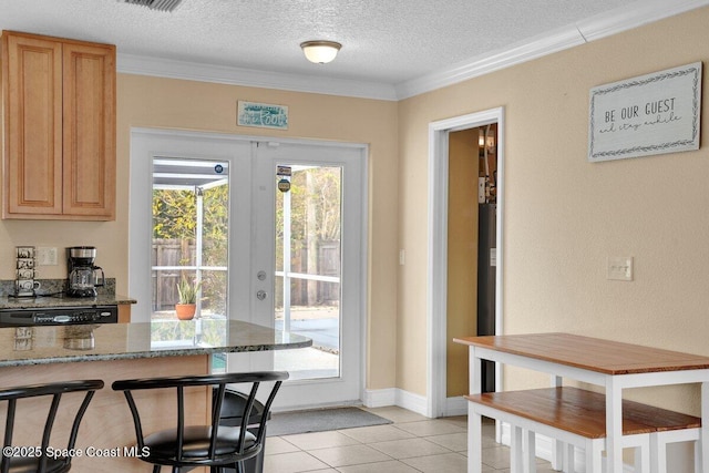 doorway featuring light tile patterned floors, crown molding, french doors, and a textured ceiling