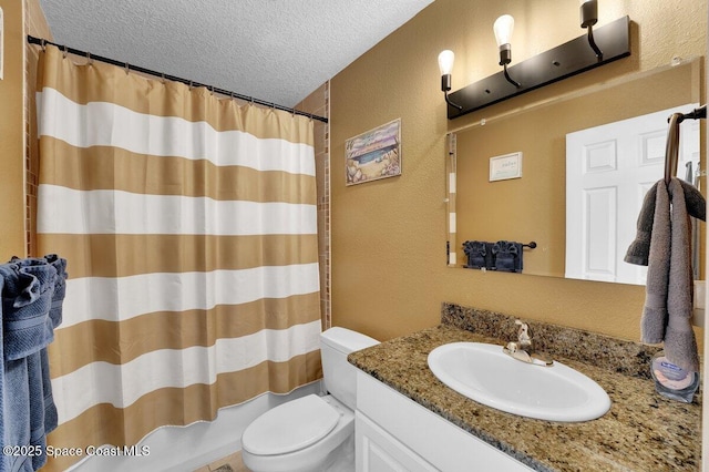 full bathroom with vanity, toilet, a textured ceiling, and shower / bath combo with shower curtain