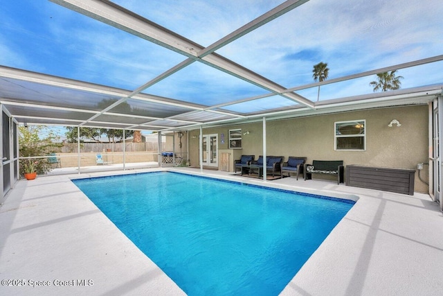 view of swimming pool with a lanai, an outdoor hangout area, and a patio