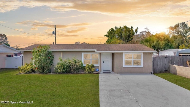 ranch-style house featuring a yard