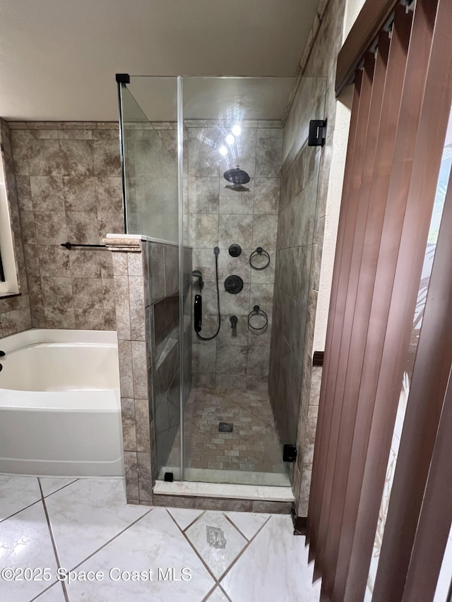 bathroom with independent shower and bath