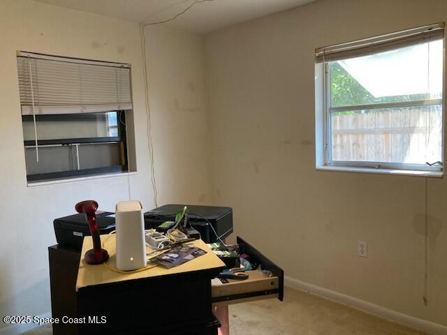 view of carpeted home office