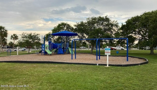 community jungle gym with a lawn