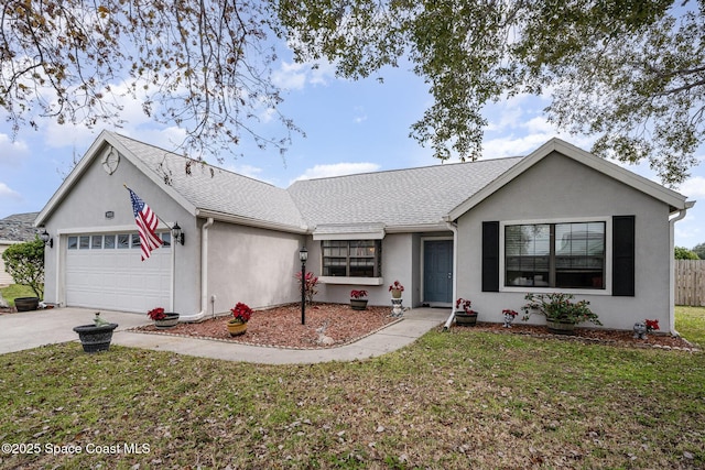 single story home with a garage and a front lawn