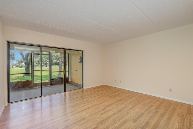 empty room with light hardwood / wood-style floors