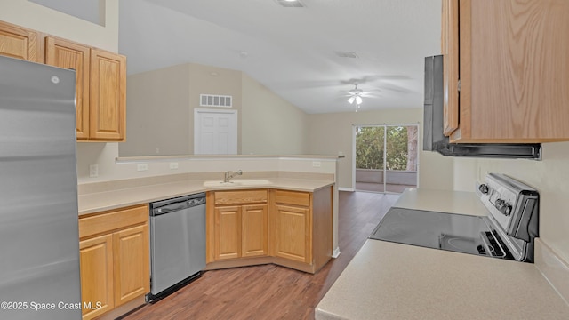 kitchen featuring sink, light brown cabinets, appliances with stainless steel finishes, and kitchen peninsula