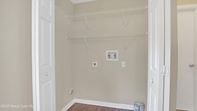 laundry area with hookup for a washing machine, dark hardwood / wood-style floors, and electric dryer hookup