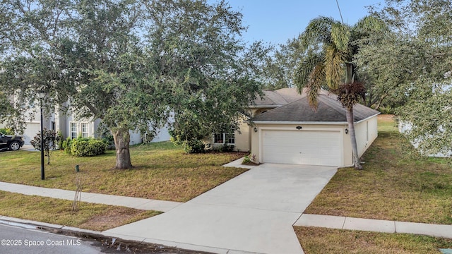 view of front facade with a garage and a front yard