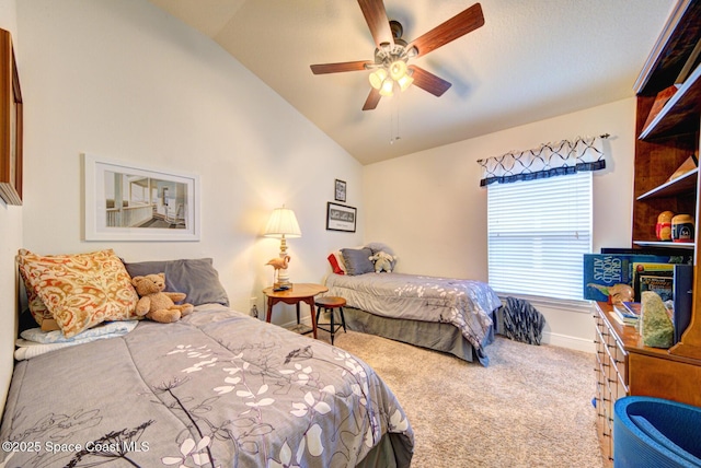 carpeted bedroom with vaulted ceiling and ceiling fan