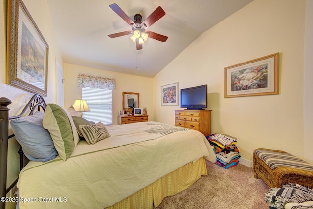 carpeted bedroom featuring lofted ceiling and ceiling fan