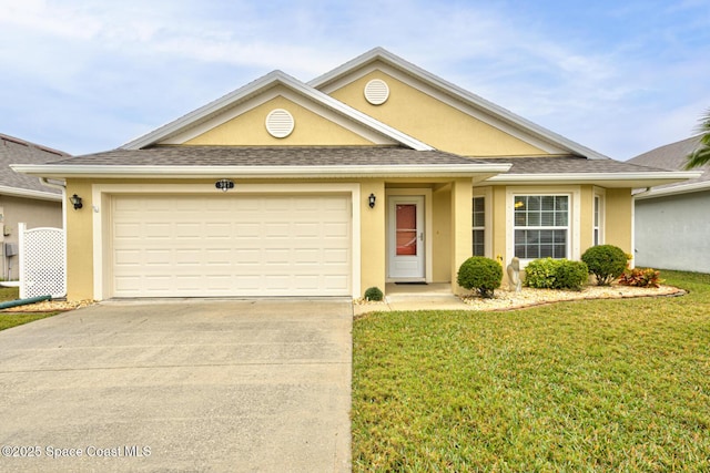 view of front of house featuring a garage and a front yard