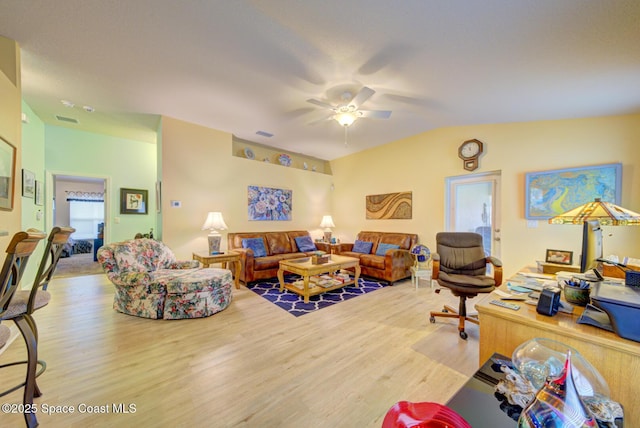 living room with hardwood / wood-style flooring and ceiling fan