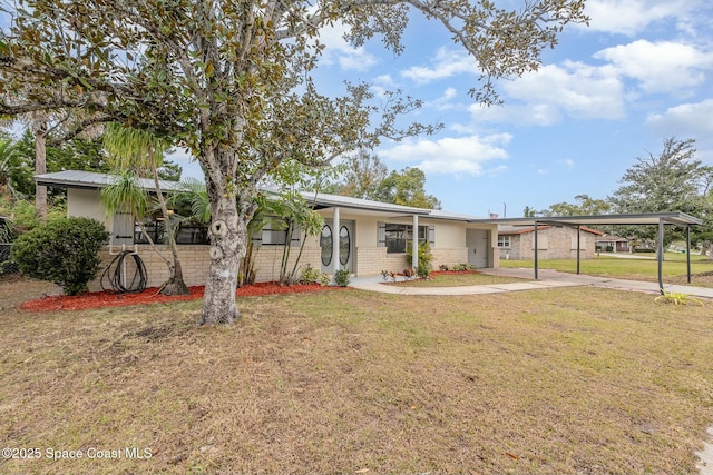 ranch-style house featuring a front yard and a carport