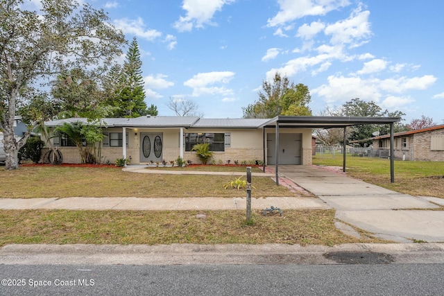 view of front facade with a front lawn and a carport