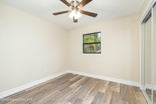 unfurnished bedroom featuring ceiling fan, light hardwood / wood-style flooring, and a closet