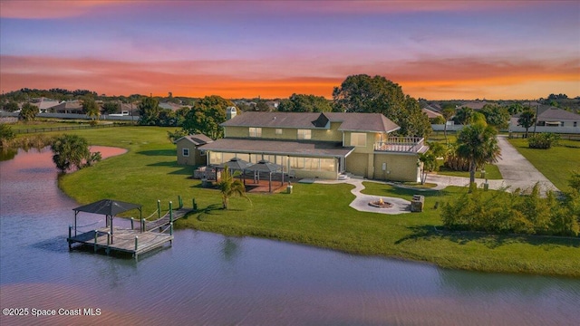 aerial view at dusk with a water view