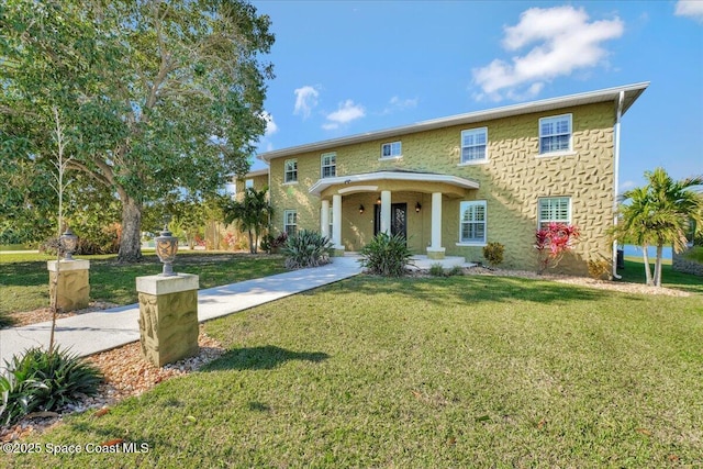 view of front facade with a front lawn