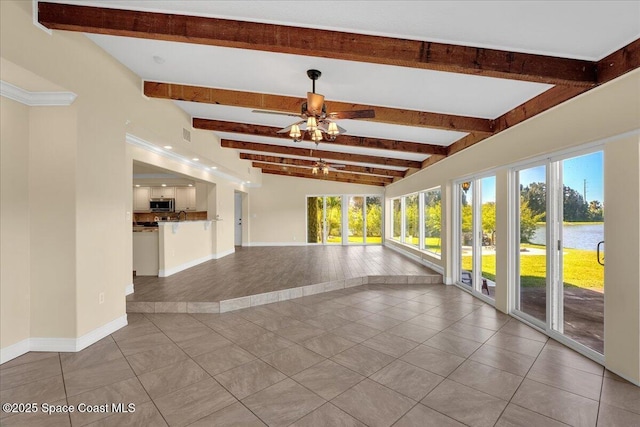 empty room featuring a water view, ceiling fan, light tile patterned flooring, and lofted ceiling with beams