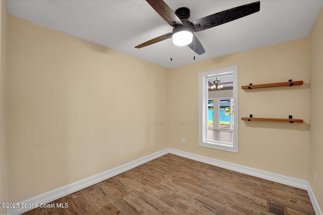 unfurnished room featuring hardwood / wood-style flooring and ceiling fan