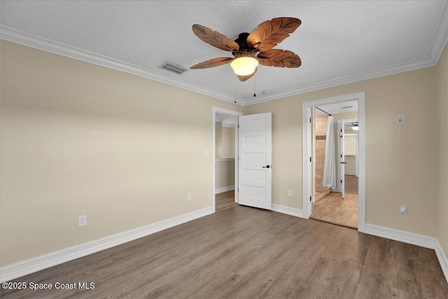 unfurnished bedroom featuring crown molding, ceiling fan, and light hardwood / wood-style floors